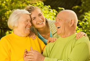 Caregiver laughing with older adults