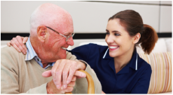 Caregiver smiling with an older client