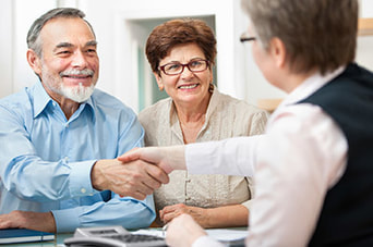 Caregiver shaking hands with a client